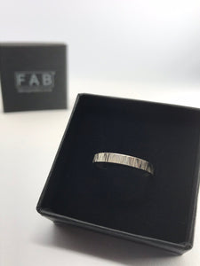 Close Up Of Textured Linear Sterling Silver Ladies Ring In Supplied Jewellery Box.