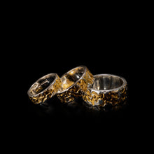 Load image into Gallery viewer, Camo Mens &amp; Womens Sterling Silver Gold Rings Shining On Black Glossy Background.