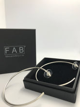 Load image into Gallery viewer, Solid Sterling Silver hoop 2mm earrings extra large, shown laying on Eco Friendly Jewellery box. 