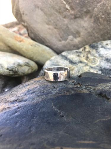 Solo Men's Handmade Textured Sterling Silver Ring Sat On Rocks At Gwithian Beach Cornwall.