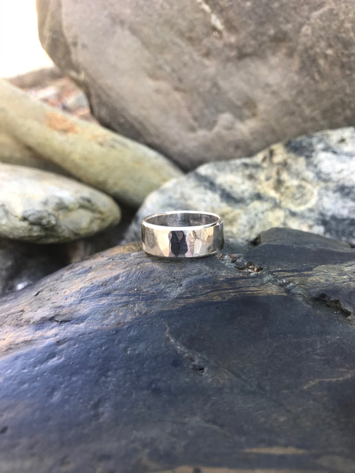 Solo Men's Handmade Textured Sterling Silver Ring Sat On Rocks At Gwithian Beach Cornwall.