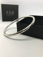 Load image into Gallery viewer, 925 Sterling silver handmade bangle glistening on its ECO Friendly box. Made from 4mm diameter solid silver wire.