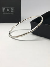 Load image into Gallery viewer, Solid silver smooth finish, plain bangle, 3mm thickness, pictured next to its own Eco friendly box.