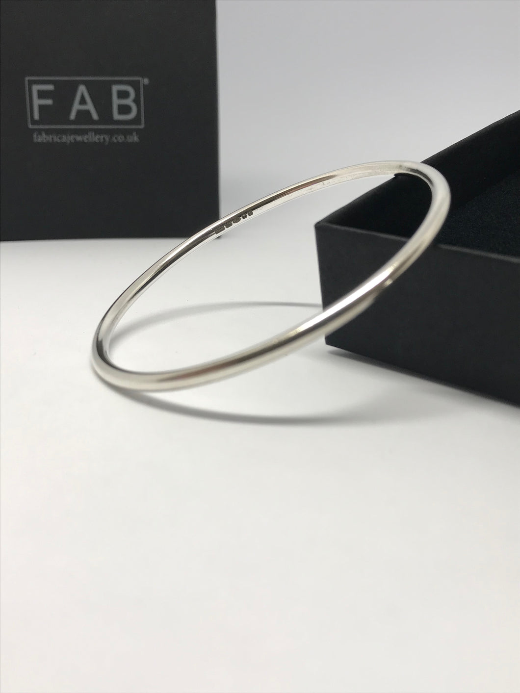 Solid silver smooth finish, plain bangle, 3mm thickness, pictured next to its own Eco friendly box.