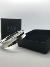 Load image into Gallery viewer, 925 Sterling Silver Planished Texture Anticlastic Bracelet Leaning On Black Eco Friendly Jewellery Box.