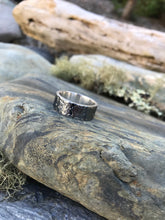 Load image into Gallery viewer, Camo mens 925 Sterling Silver textured oxidised ring sat upon the rocks in Cornwall.