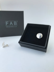 Handmade Sterling Silver Convex Domed Round Hammered Stud Earrings. One Shown In Front Of Box.