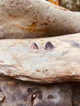 Load image into Gallery viewer, Handmade Love Heart Hammered Sterling Silver Stud Earring 925 sat upon rocks in Cornwall.