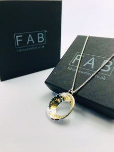 Radiance Pendant & Chain 24k Gold Sterling Silver Laying Across Black FAB Jewellery Box.