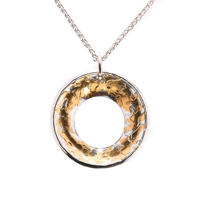 925 Sterling Silver & 24k Gold Pendant Dazzling Against Bright White Background.