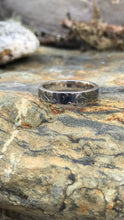 Load image into Gallery viewer, Ladies 925 textured and oxidised ring sat upon a rock.