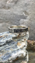 Load image into Gallery viewer, Sterling Silver Women&#39;s etched and oxidised ring perched on a rock.